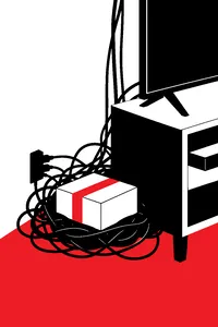 A tangle of black cables behind a TV stand with a small unopened shipping box sitting right on top of the tangle.