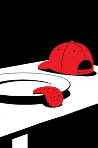 A single droopy biscuit wilting over the edge of a plate beside a backwards red baseball cap.
