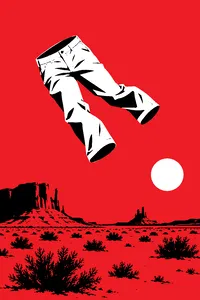 A pair of khaki pants tumbling through a clear blue sky above red desert scrub.
