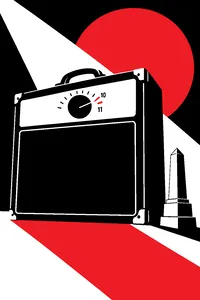 A guitar amplifier with a control knob whose markings go one notch past ten, a tiny stone monument prop beside it.