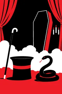 A top hat, a cane and a coiled snake prop on a foggy stage with a coffin propped against the backdrop.