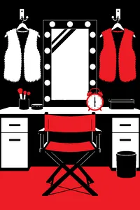 Two furry vests hung on separate hooks in a TV studio dressing room, a mirror ringed with bulbs between them and an alarm clock reading 6:00.