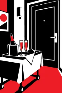A hotel room service tray with two champagne glasses outside a closed hotel door.