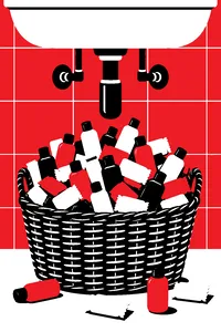 A wicker basket under a bathroom sink overflowing with tiny unlabeled shampoo bottles and wrapped soaps.