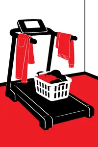 A home treadmill in a spare room with jeans and sweaters draped over its handrails and a laundry basket on the belt.