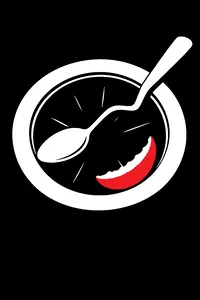 A dark kitchen sink drain with its rubber splash guard, a bent spoon and a lemon rind resting at the opening.