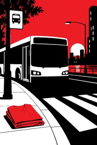 A city bus stopped at a crosswalk at dusk, a pair of surgical scrubs folded neatly on the curb.