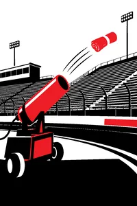 A T-shirt cannon on the infield of a speedway, a rolled-up shirt flying toward empty bleachers.