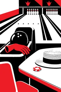 A rubber prosthetic hand resting on a ball return beside a bowling ball, an Amish straw hat and a Reno casino chip on the scorer's table.