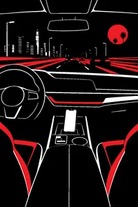 A luxury car interior at night with a glowing car phone on the console and freeway lights streaking past.