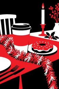 A cardboard cup of coffee next to a donut on a holiday dinner table, a single string of tinsel draped over it.