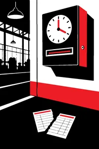 A punch clock on a factory wall with a single time card torn in half on the floor below it.