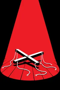 Wooden marionette controls with slack, cut strings lying on a stage floor under a blue spotlight.