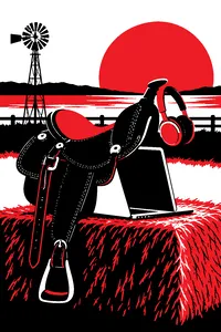 A horse saddle draped over a laptop on a hay bale, a pair of headphones hanging from the saddle horn at sunset.