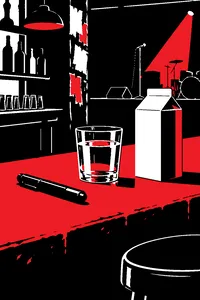 A black marker resting beside a glass of water and a carton of milk on a dingy punk club bar.