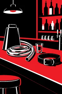 A cowbell and a coiled talk-box tube on a bar top beside a shot glass and a sleeping dog's collar.