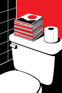 A tall stack of small digest-size magazines on the back of a toilet tank beside a spare roll of toilet paper.