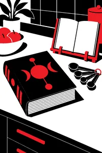 A heavy alien book with strange glyphs on its cover lying on a kitchen counter beside a cookbook stand and a set of measuring spoons.