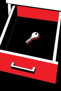 A single worn brass key lying alone on the bottom of an otherwise empty drawer, a faint dust outline around it.