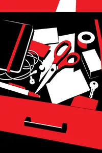 A pair of sharp orange-handled scissors half-buried under drawer clutter, a shaft of light falling directly on them.